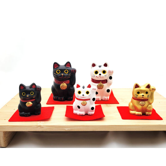 White and black maneki-neko figurine